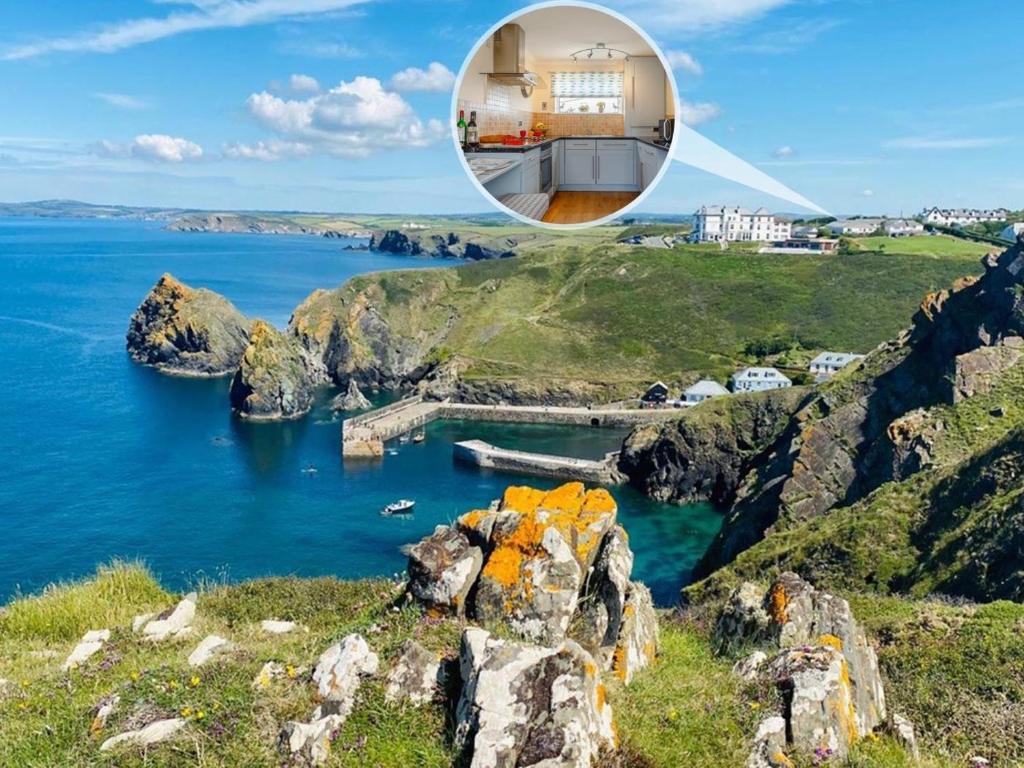 a house on a cliff overlooking a body of water at 2 Bed in Helston oc-54556 in Mullion