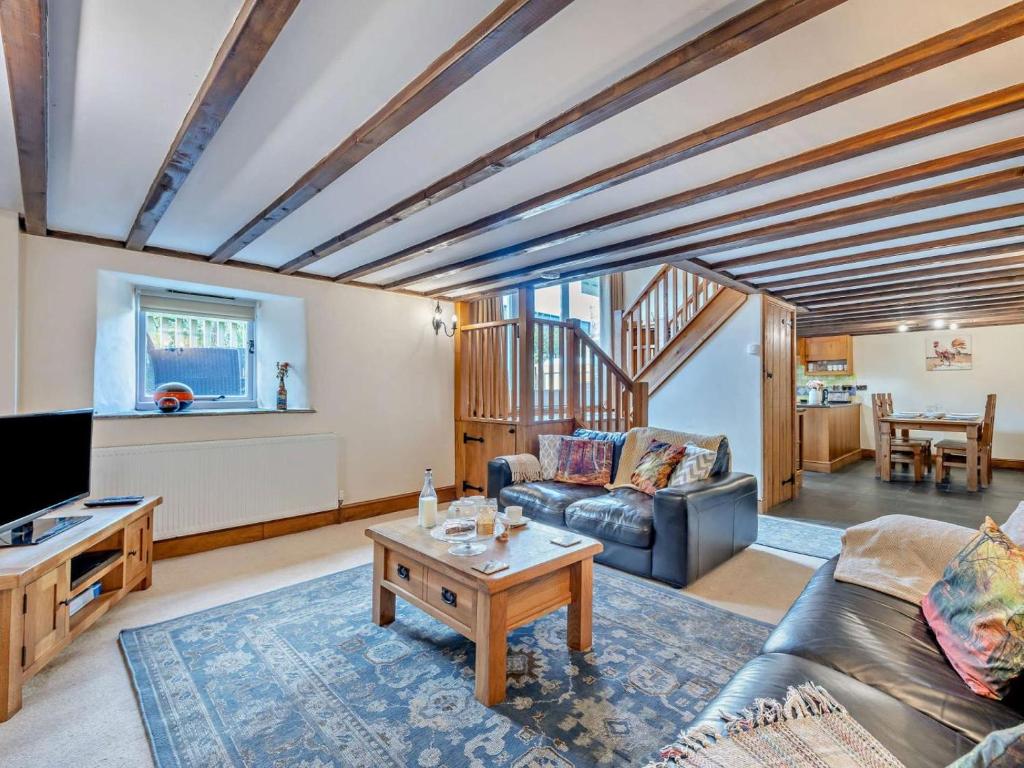 a living room with a couch and a table at 2 Bed in Launceston oc-95236 in Saint Giles on the Heath