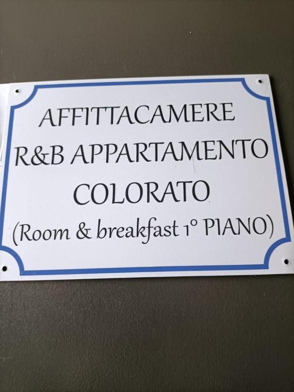 a sign on a wall that reads apartmentate rdb application coordinator coordinator coordinatorron at Affittacamere Appartamento colorato in Ferrara