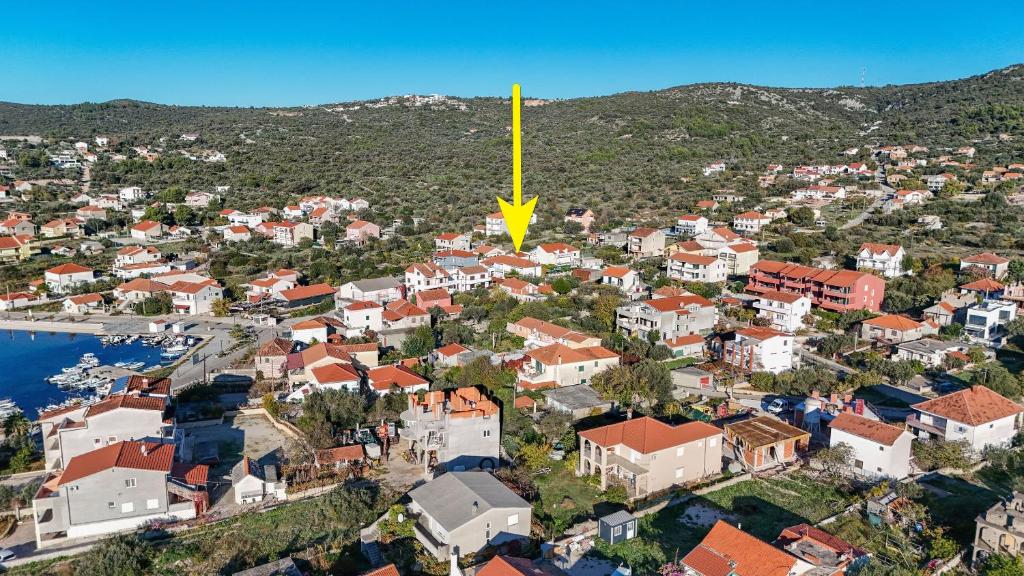 an aerial view of a town with a yellow pole at House Boze in Vinišće