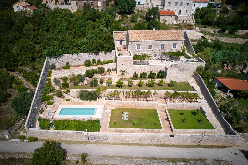 an aerial view of a house with a garden at Renaissance Palace Ghetaldi 1516 in Suđurađ