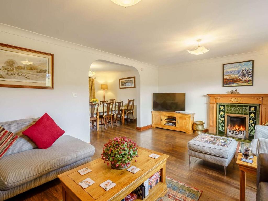 a living room with a couch and a table at 3 Bed in Penrith oc-90990 in Pooley Bridge