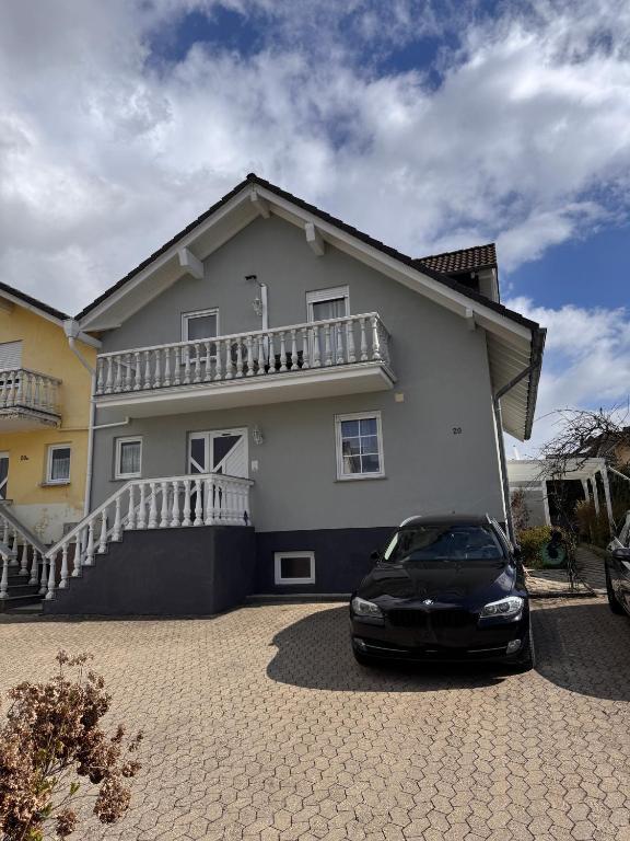 a car parked in front of a house at Ferienapartment Lidia in Kastellaun