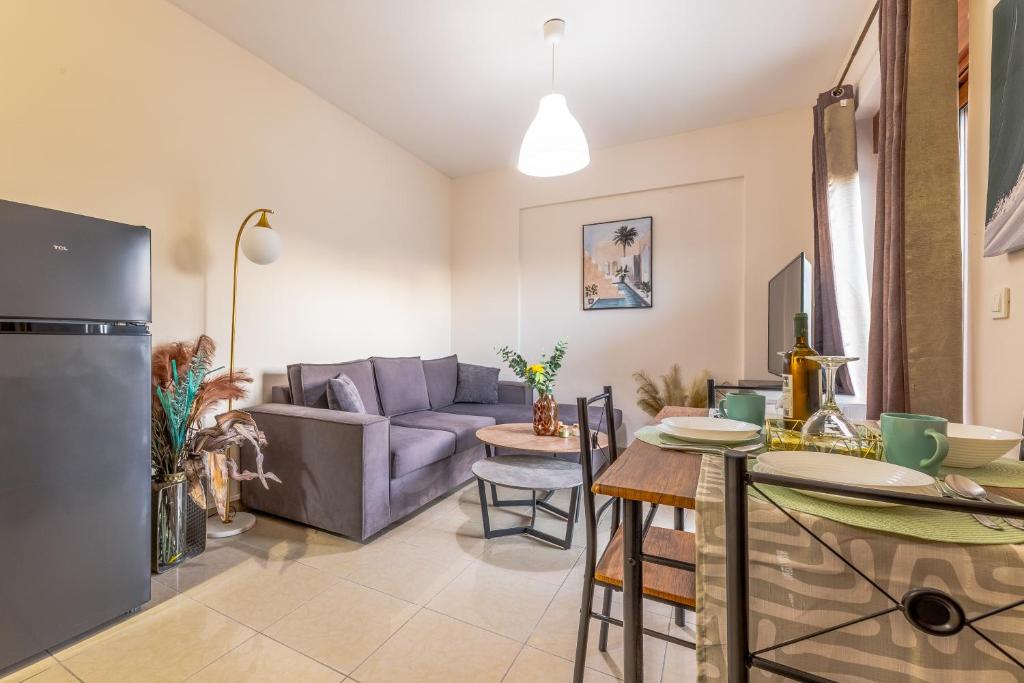 a kitchen and living room with a couch and a table at LuckyWoodyApartment in (( Kermetés ))