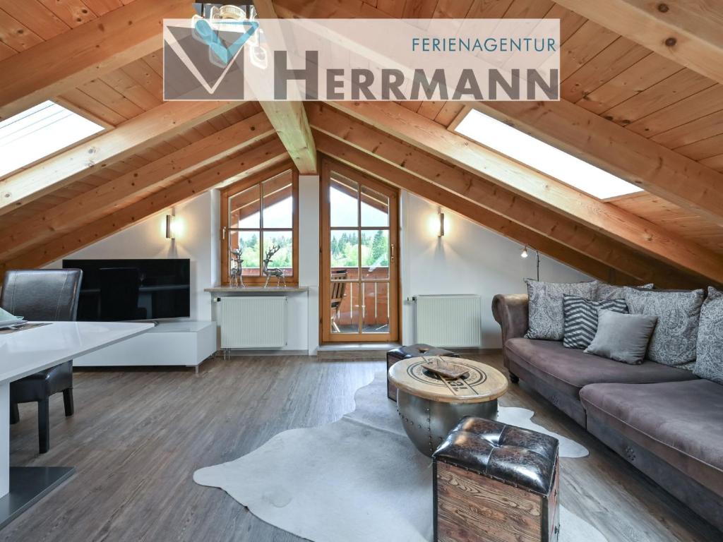 a living room with a couch and a table at Chalet im Haus Schlossblick in Füssen