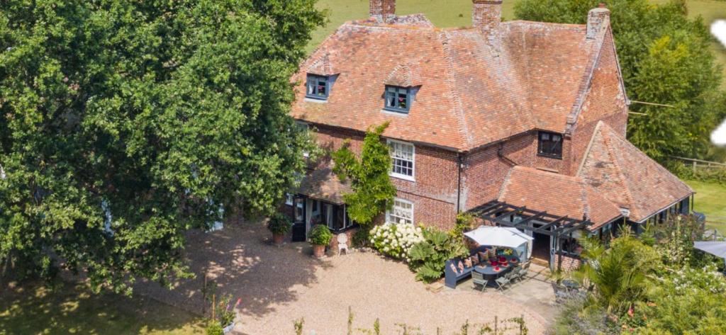 an aerial view of a large brick house at 16th Century Manor House in Richborough