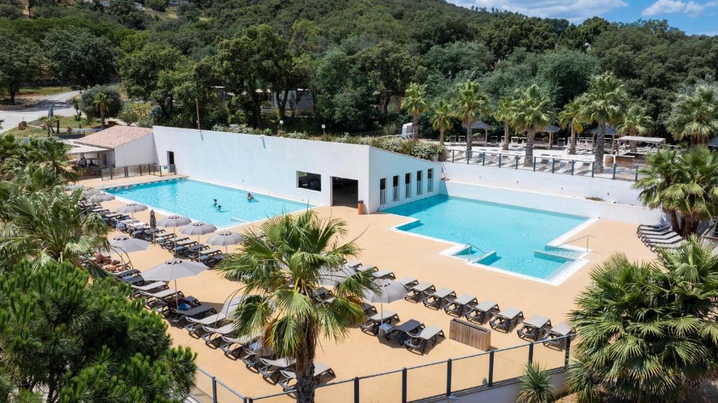 an overhead view of the pool at a resort at Domaine de Miremer in La Garde-Freinet