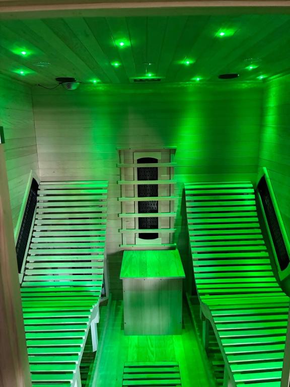 a room with green lights on the stairs at Retreat in Cardiff