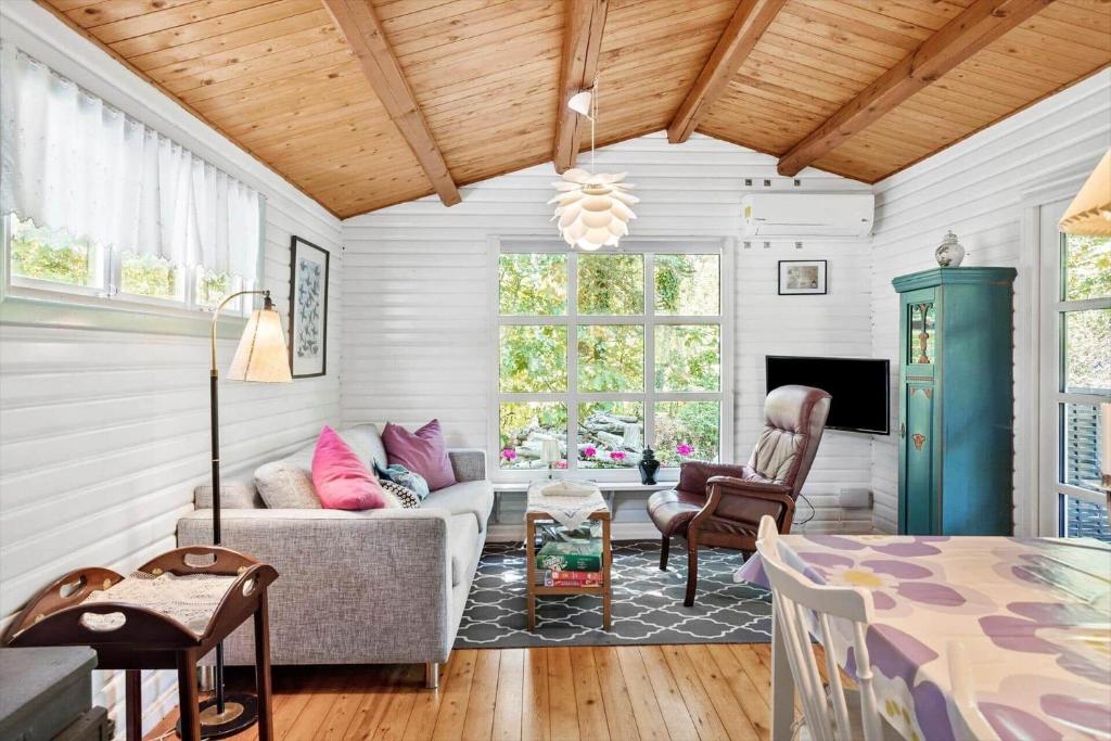 a living room with a couch and a table at 2025-Stege-Ulvshalevej-319 in Stege