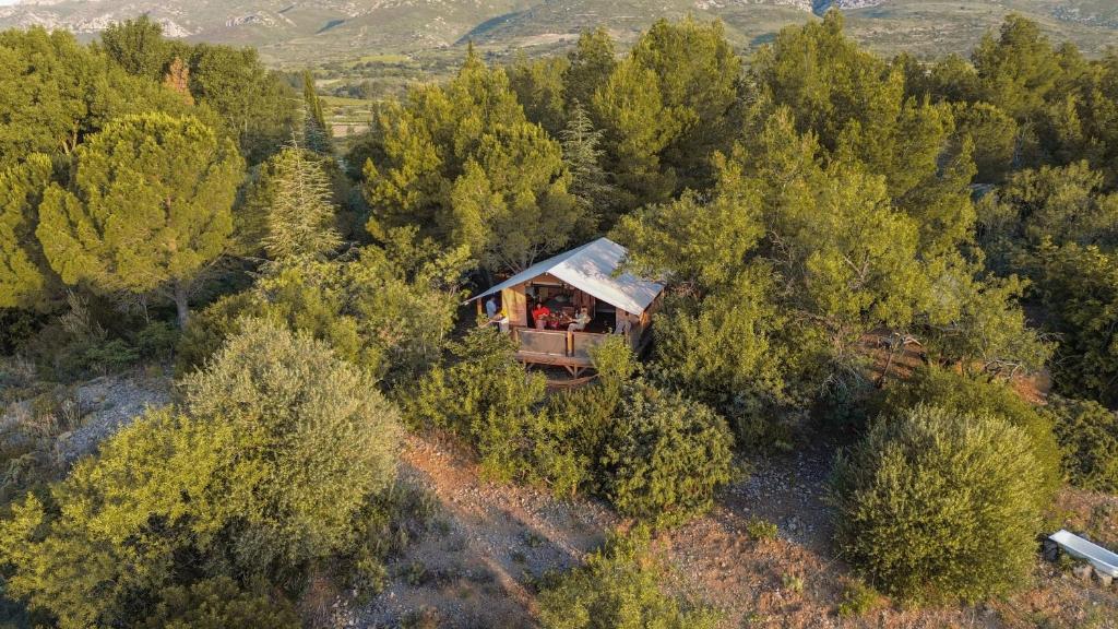 an aerial view of a house in the middle of a forest at Camping la Peiriere - Lodge en Pays Cathare in Tuchan