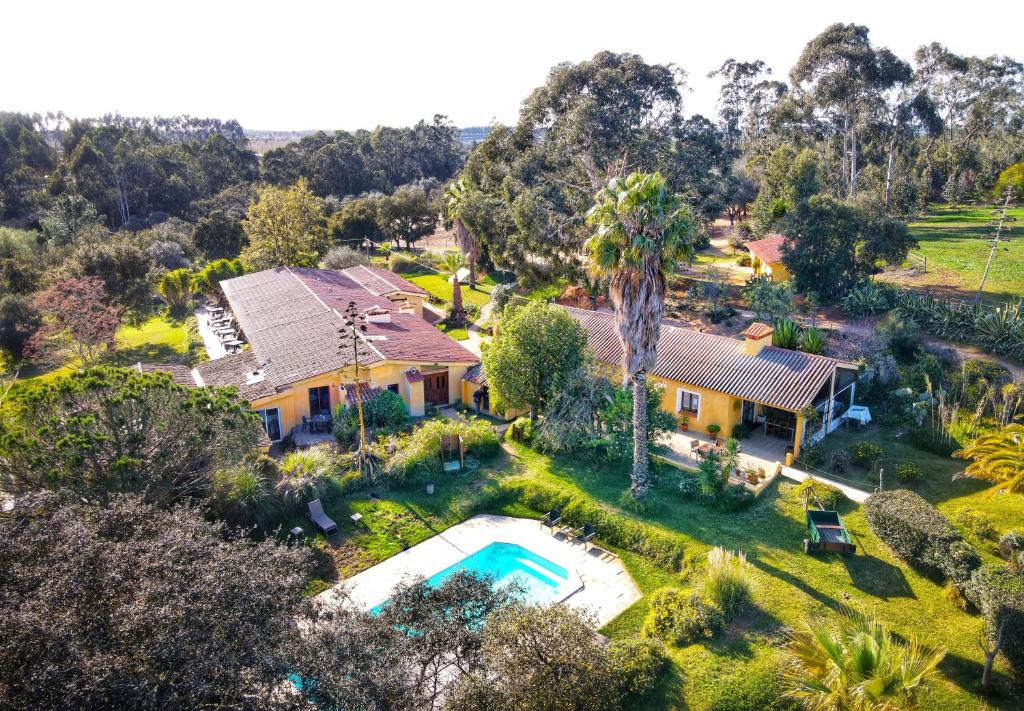 an aerial view of a house with a swimming pool at Quinta Pedagogica da Samoqueirinha - Duna Parque Group in Vila Nova de Milfontes