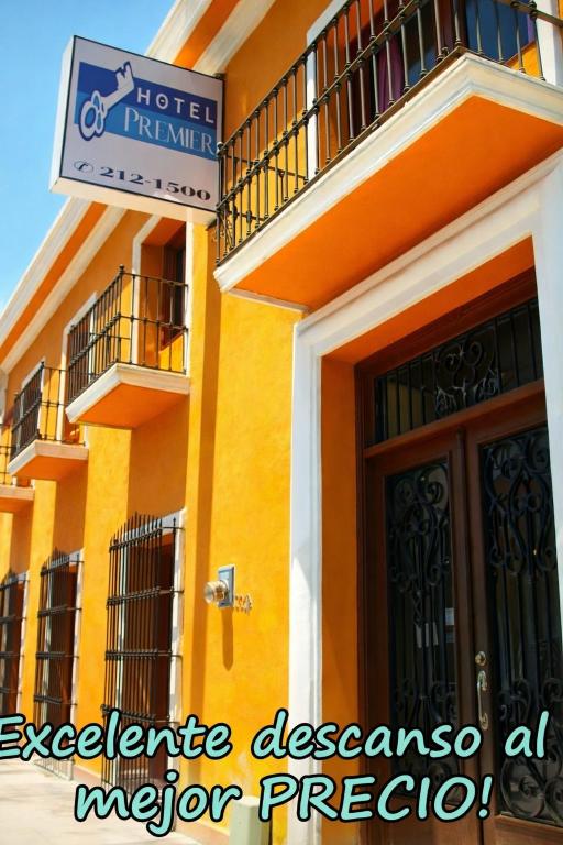 a hotel in mexico with a door and a sign at Hotel PREMIER in Linares