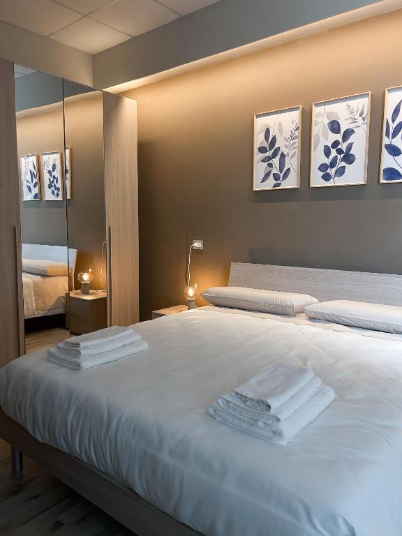 Giường trong phòng chung tại STAY COMODO Rooms
