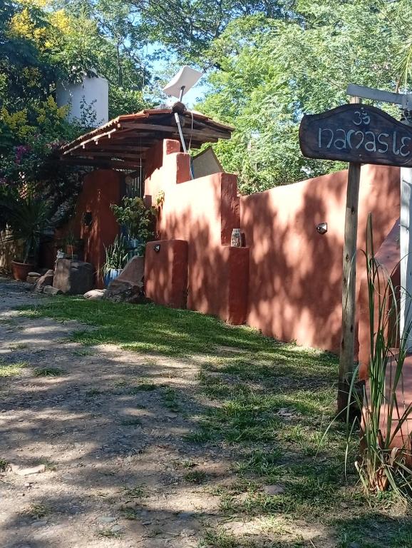 a street sign in front of a house at Namasté Casa Rural in Vaqueros