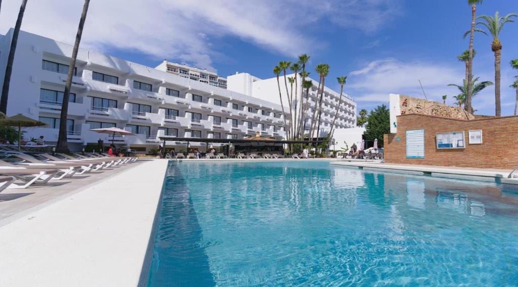 a large swimming pool in front of a hotel at BLUESEA Al Andalus in Torremolinos