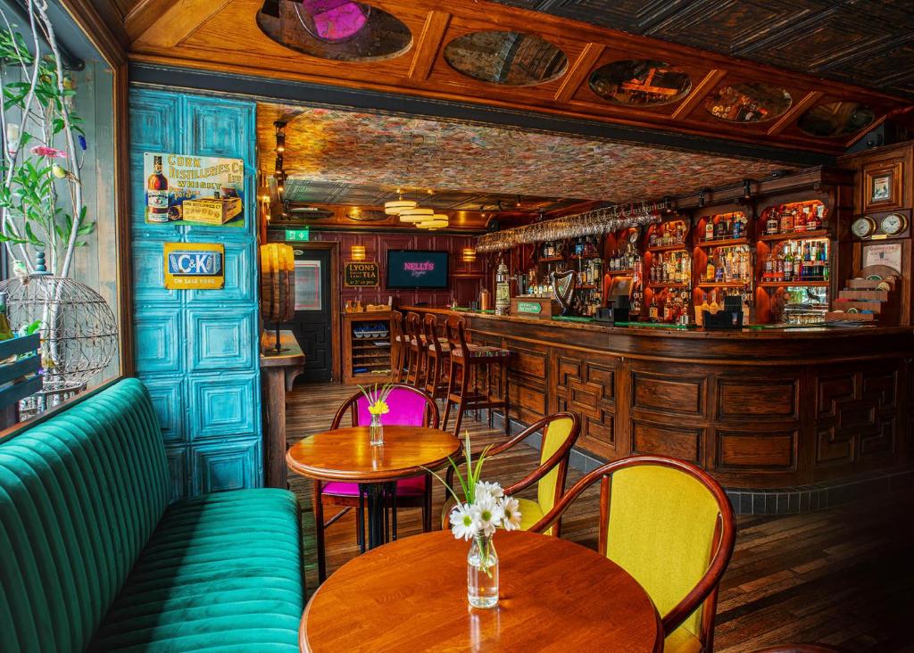 a restaurant with tables and chairs and a bar at The Marcy Hotel in Drogheda