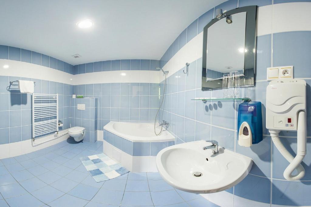 Koupelna v ubytování Hotel Sun