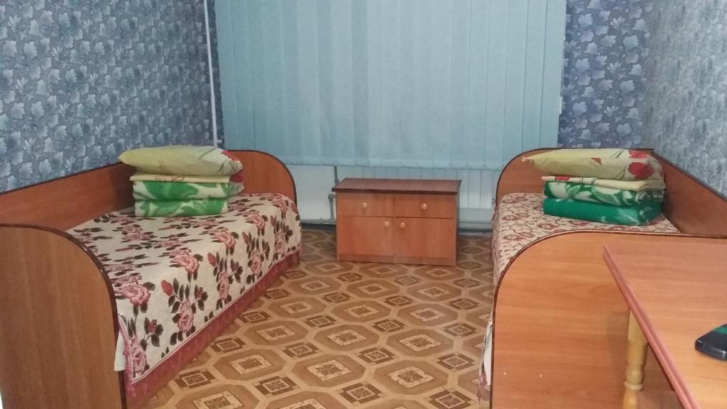 Postel nebo postele na pokoji v ubytování Hotel Yuvileyny