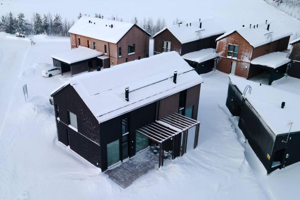 an aerial view of a building in the snow at Joiku A1 Luxury Chalet in Kolari