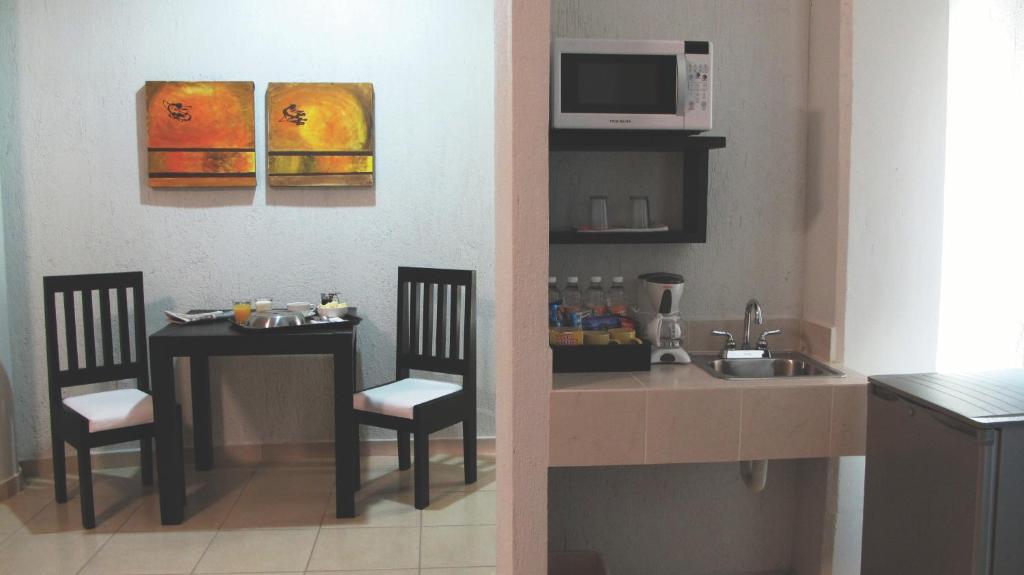 Kuchyň nebo kuchyňský kout v ubytování Hotel RS Suites