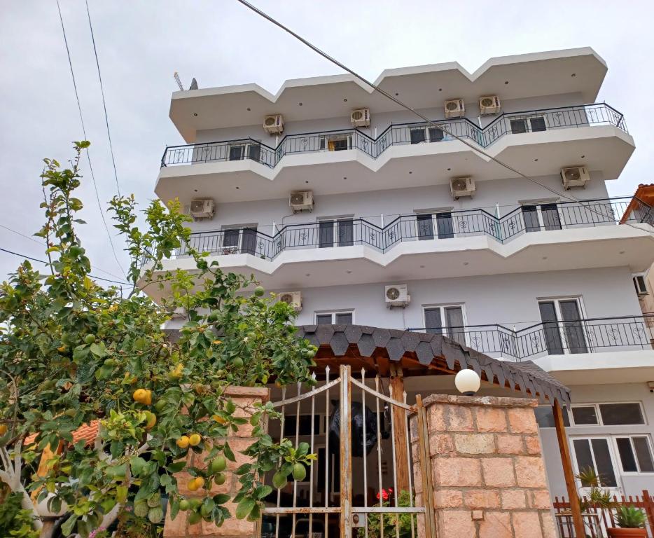 a building with balconies on top of it at ARILEO ROOMs in Himare