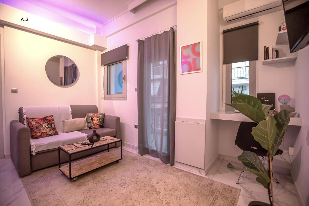 a living room with a couch and a table at live it _ Karditsa in Karditsa
