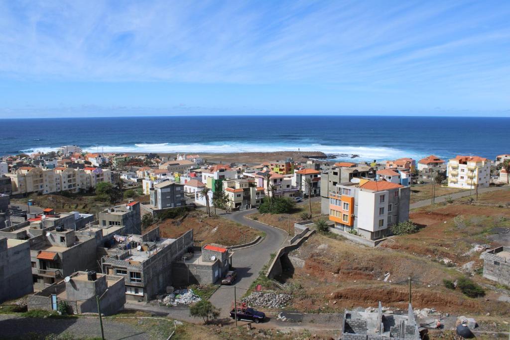 an aerial view of a city and the ocean at Casa Thisolore in Ponta do Sol