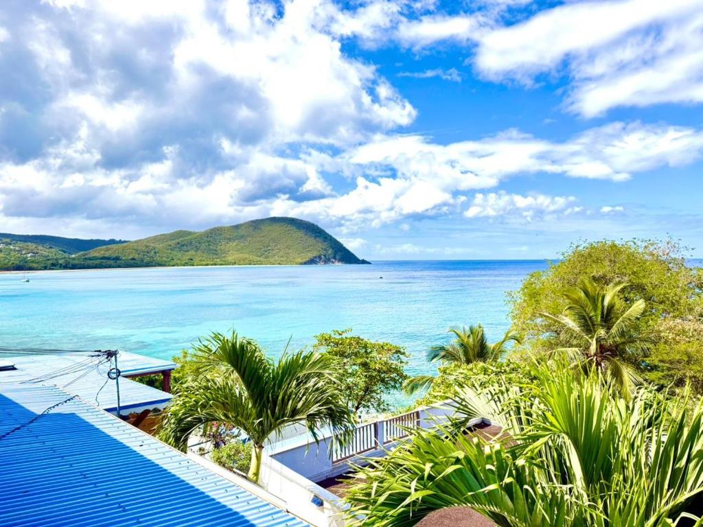 a view of the ocean from a resort at Sunset View - Panoramic Sea View - Deshaies in Deshaies
