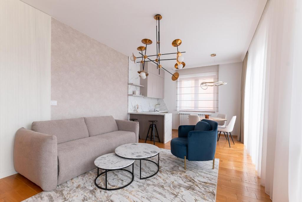 a living room with a couch and a table at Apartman Maxim in Palić