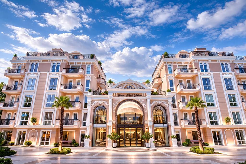 a building with palm trees in front of it at Dawn Park Deluxe 3 floor in Sunny Beach