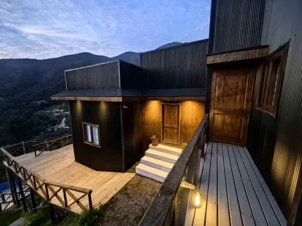 a house with a deck with stairs and a door at Terraza Olmué Piscina y Tinaja Uso Exclusivo in Olmué