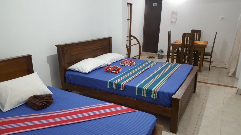 Postel nebo postele na pokoji v ubytování Kandy Hill Escape