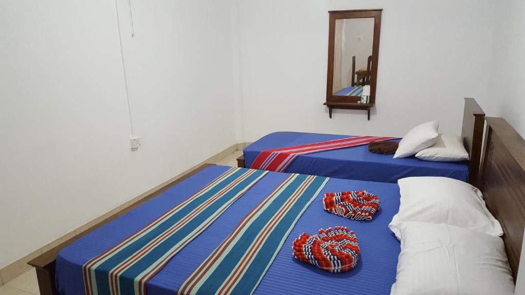 Postel nebo postele na pokoji v ubytování Kandy Hill Escape