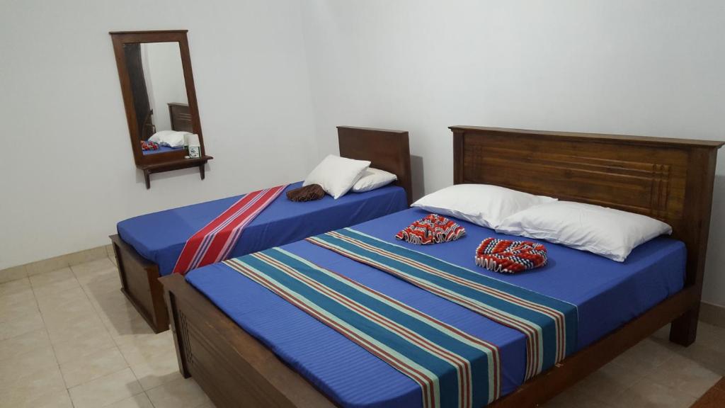 Postel nebo postele na pokoji v ubytování Kandy Hill Escape