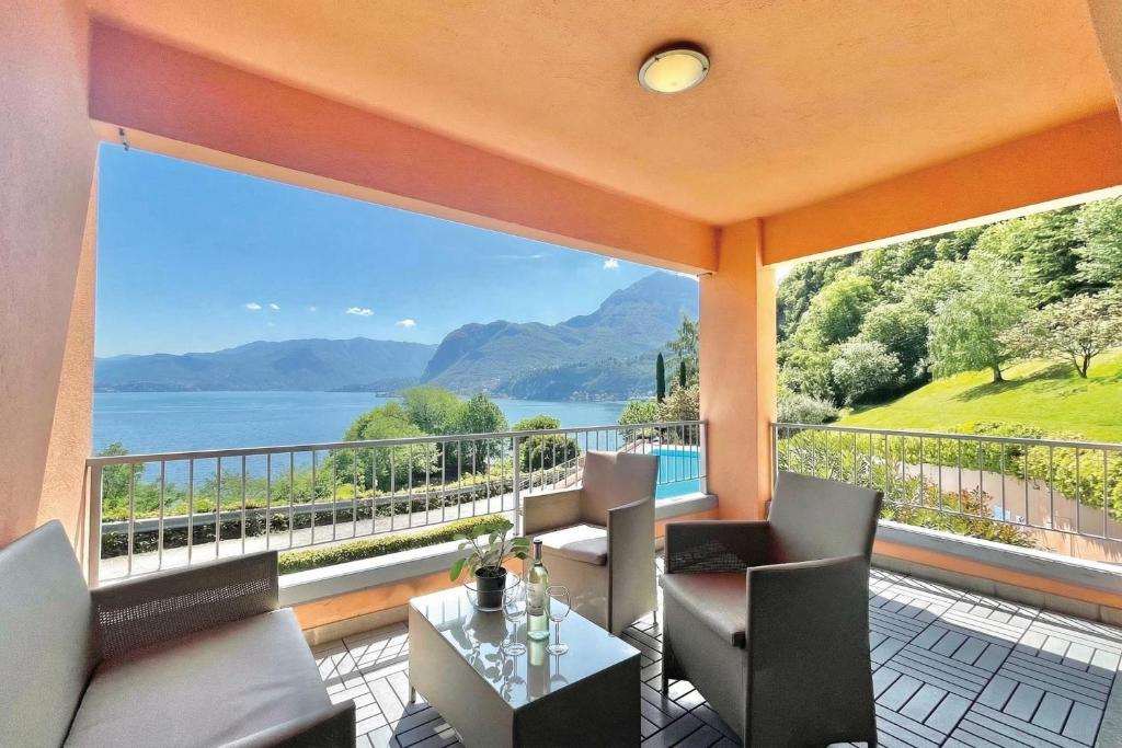 a balcony with a view of the water and mountains at Gaeta 'Lake View' in San Siro
