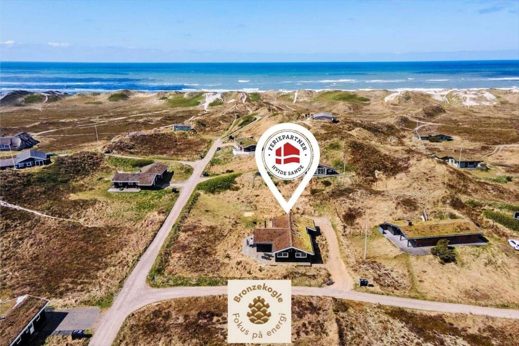 an aerial view of a property with the ocean at 135-Ringkobing-Sortebaerdalen-51 in Kryle