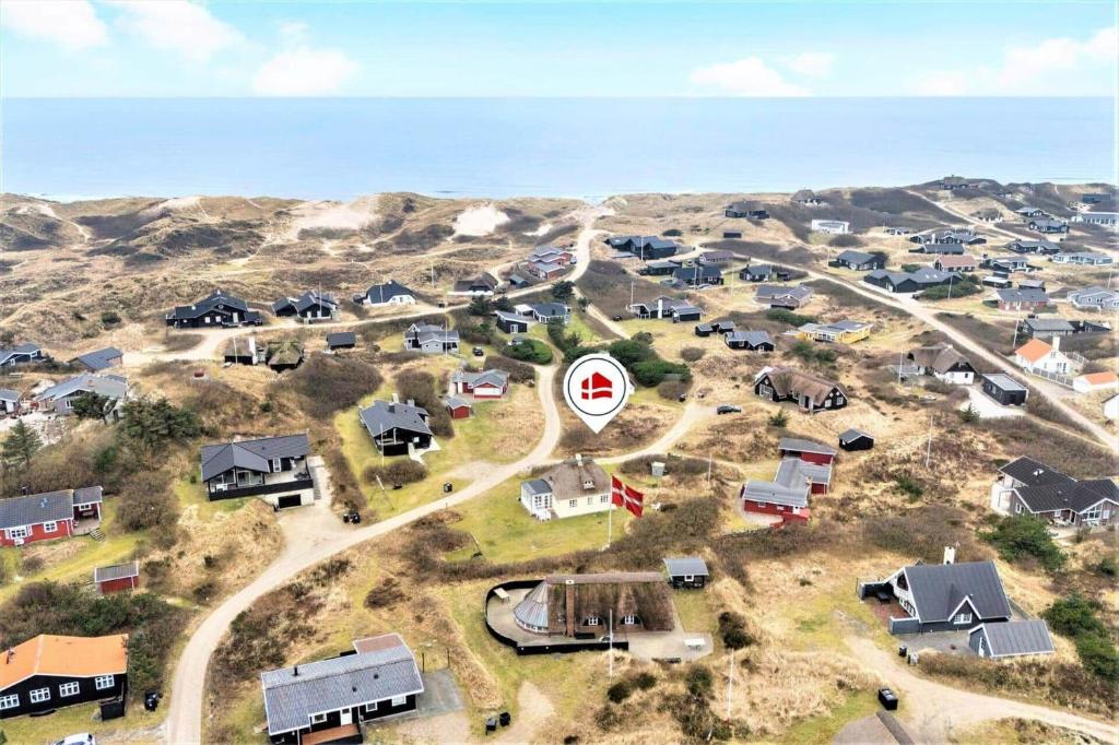 an aerial view of a village with houses and a road at 1154-Ringkobing-Nordsovej-50 in Søndervig