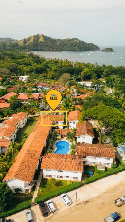an aerial view of a resort with a swimming pool at Tropical Beach Second Floor Studio with Hill view in Coco