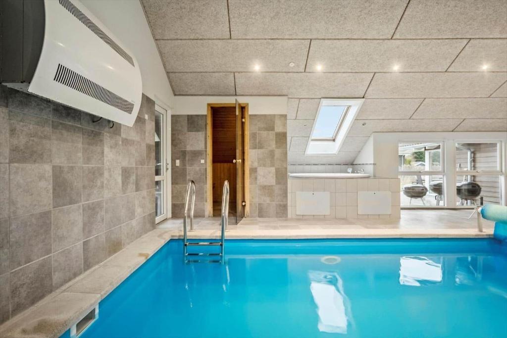 a swimming pool in a house at M235-Vaeggerlose-Kaninstien-33 in Bøtø By