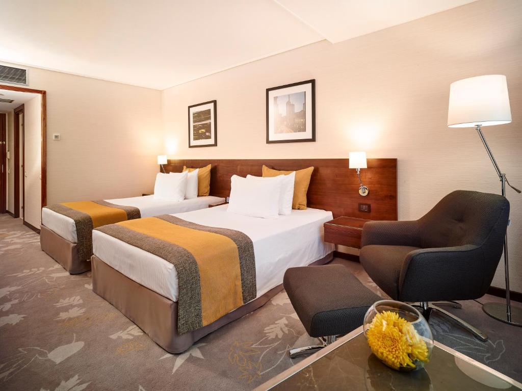 Postel nebo postele na pokoji v ubytování Crowne Plaza Bucharest by IHG