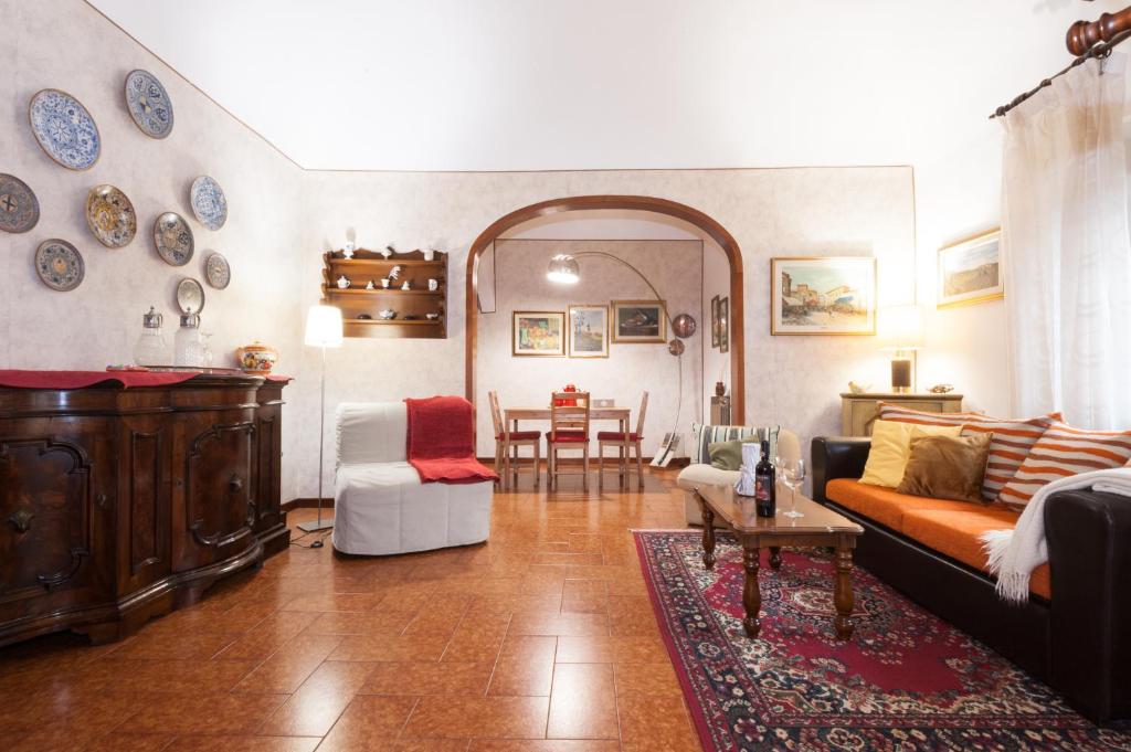 a living room with a couch and a table at Casa Vacanze Le Piagge di Scappini Simona in Montelupo Fiorentino