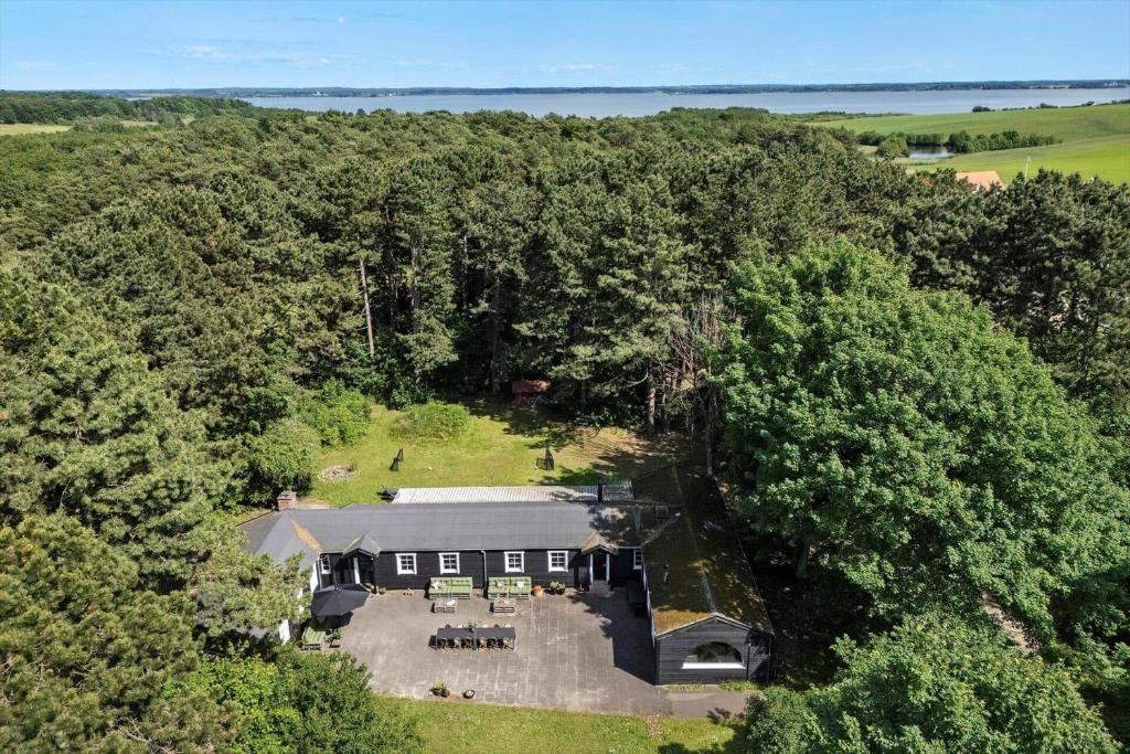 an overhead view of a large house in the woods at 1639-Frederiksvaerk-Genvejen-10 in Frederiksværk