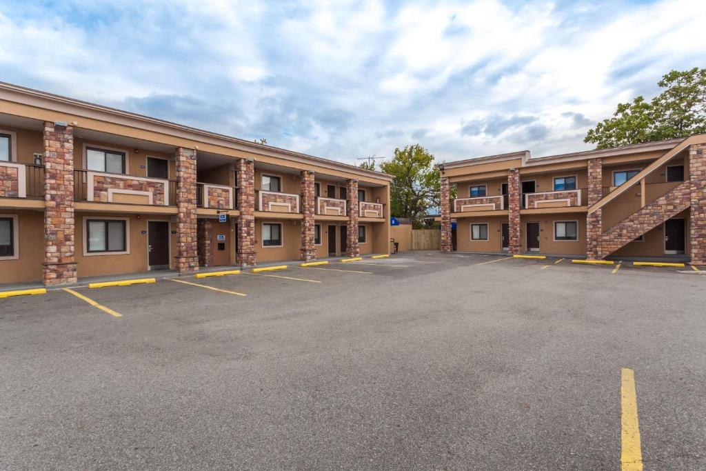 a row of buildings in a parking lot at Travelodge by Wyndham South Hackensack in South Hackensack