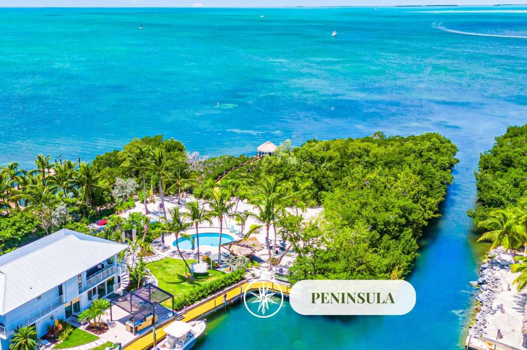 an aerial view of the palm island resort and the ocean at Peninsula Villa Boat Dock Heated Pool Sunset Point in Islamorada