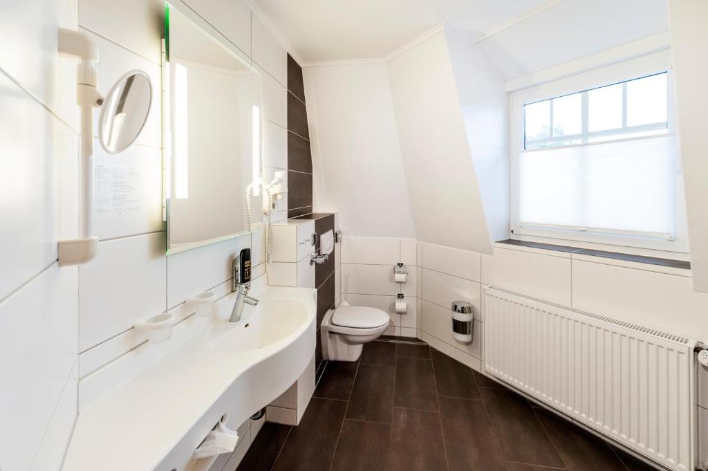 Koupelna v ubytování Hotel Hilker