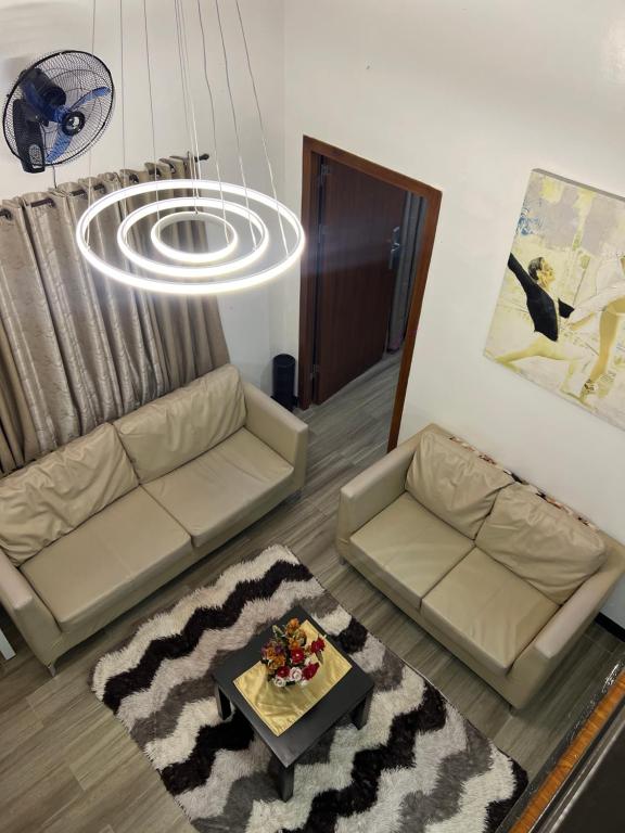 a living room with a couch and a table at KMRP Condo Unit in Baguio