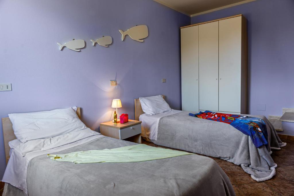 Postel nebo postele na pokoji v ubytování Villetta Dino