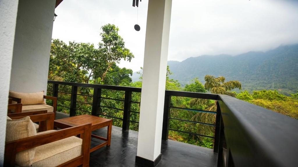 a balcony with a view of the mountains at Visbury Villa in Gangaboda