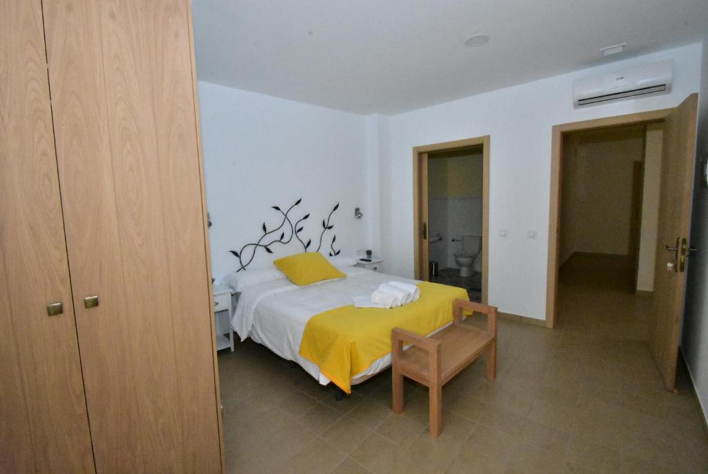 Postel nebo postele na pokoji v ubytování Hostal Aquaforum