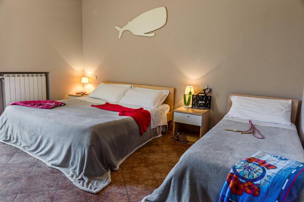 Postel nebo postele na pokoji v ubytování Villetta Dino